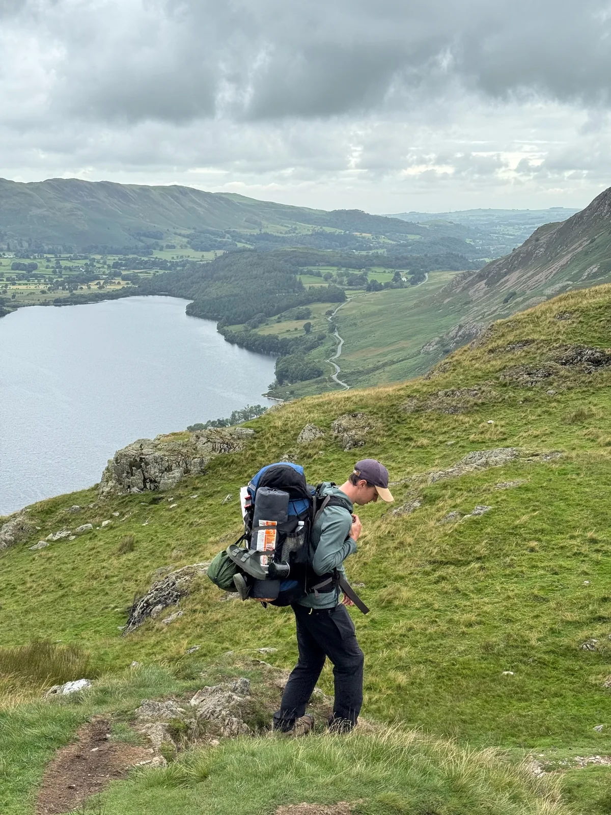 Sam backpacking above a lake in the Lake District